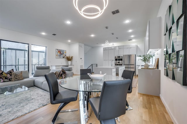 dining room with light hardwood / wood-style flooring