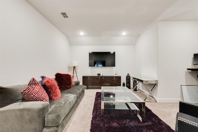 living room with lofted ceiling and carpet floors