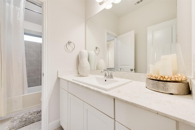 bathroom with vanity and shower / bath combination with curtain