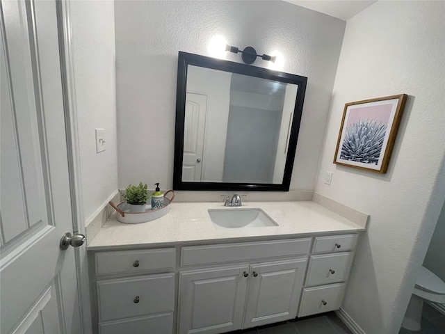 bathroom featuring vanity and tile patterned flooring