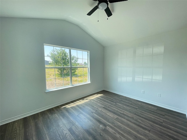 spare room with lofted ceiling, dark hardwood / wood-style floors, and ceiling fan