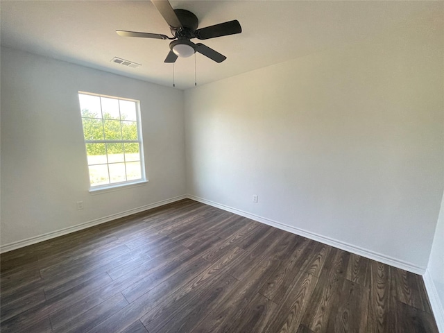 unfurnished room with ceiling fan and dark hardwood / wood-style flooring