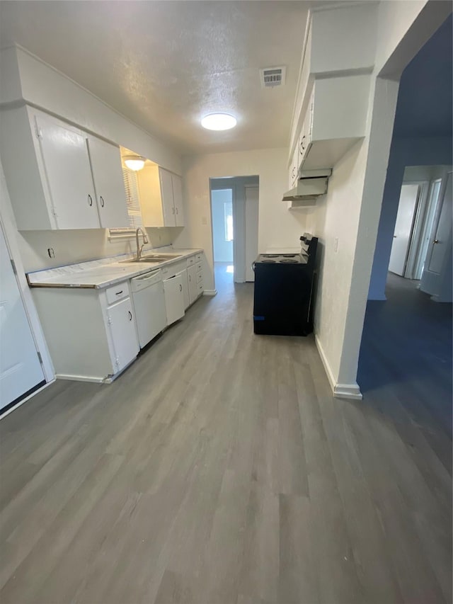 kitchen featuring dishwasher, white cabinets, a textured ceiling, and sink