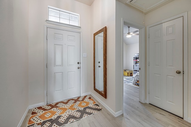 entrance foyer featuring ceiling fan and light hardwood / wood-style flooring