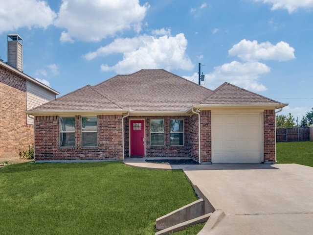 ranch-style house featuring a garage and a front lawn