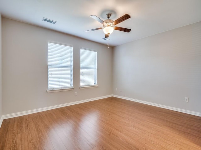 unfurnished room featuring light hardwood / wood-style floors and ceiling fan