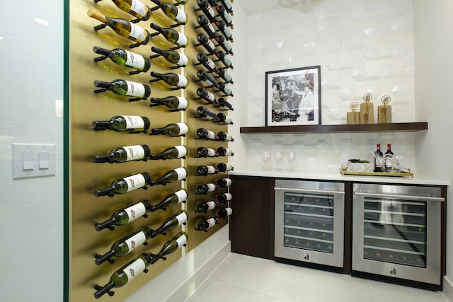 wine room featuring light tile patterned floors and wine cooler