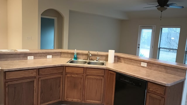 kitchen featuring sink, dishwasher, and ceiling fan