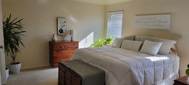 bedroom featuring light colored carpet