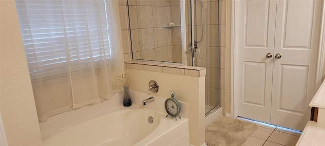 bathroom featuring independent shower and bath and tile patterned floors