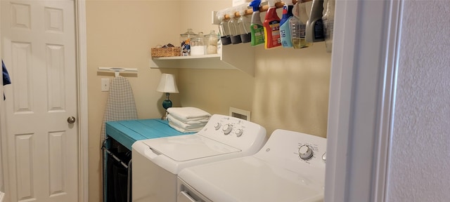 laundry area featuring washing machine and clothes dryer