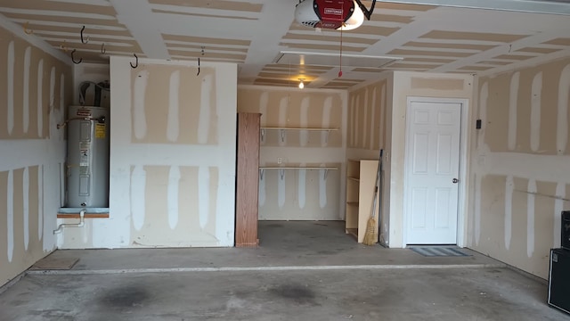 garage featuring a garage door opener and electric water heater