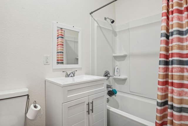 full bathroom with vanity, shower / bath combination with curtain, and toilet