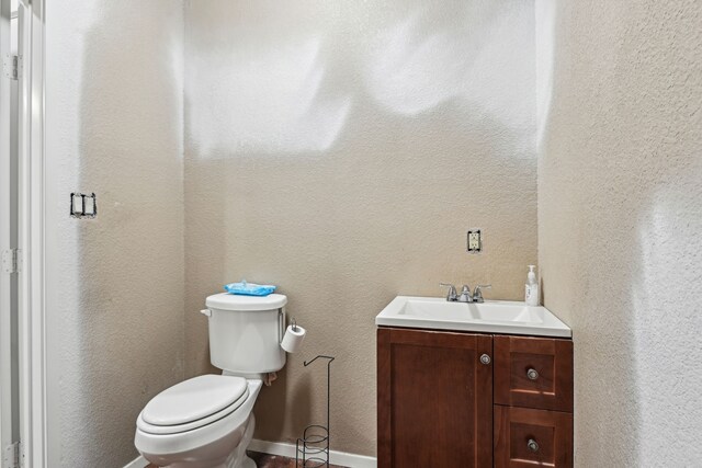 bathroom with vanity and toilet