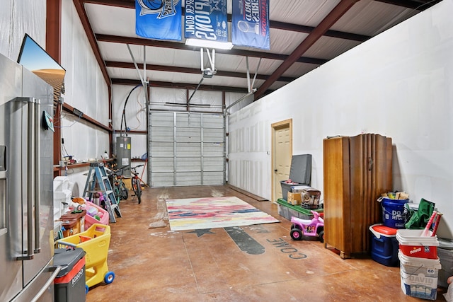 garage with stainless steel fridge with ice dispenser and water heater