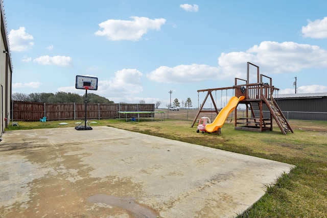 exterior space featuring a playground and a trampoline