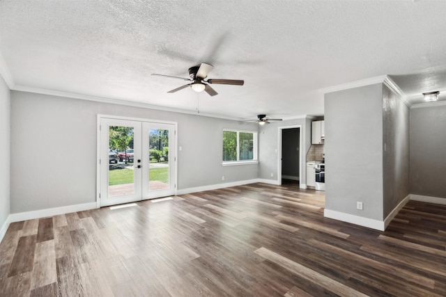 unfurnished living room featuring dark wood-style floors, baseboards, ornamental molding, and french doors