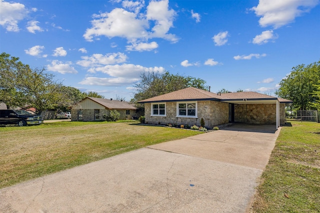 ranch-style house with a carport and a front lawn