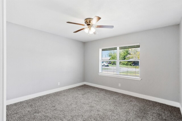 carpeted empty room with ceiling fan