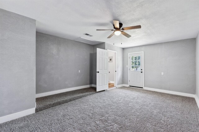 unfurnished bedroom featuring ceiling fan and dark colored carpet