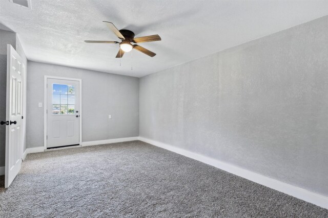 empty room with carpet flooring and ceiling fan