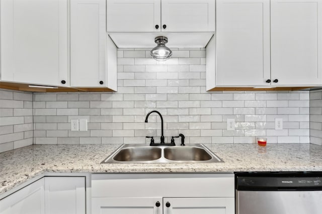 kitchen with white cabinets, decorative backsplash, dishwasher, and sink