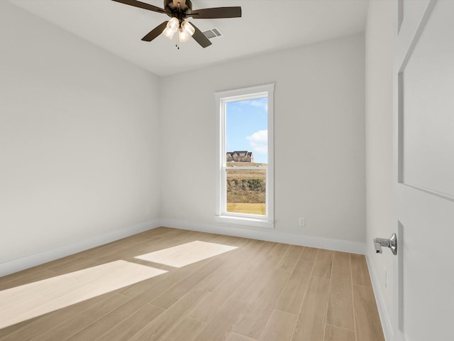 spare room featuring ceiling fan and light hardwood / wood-style floors