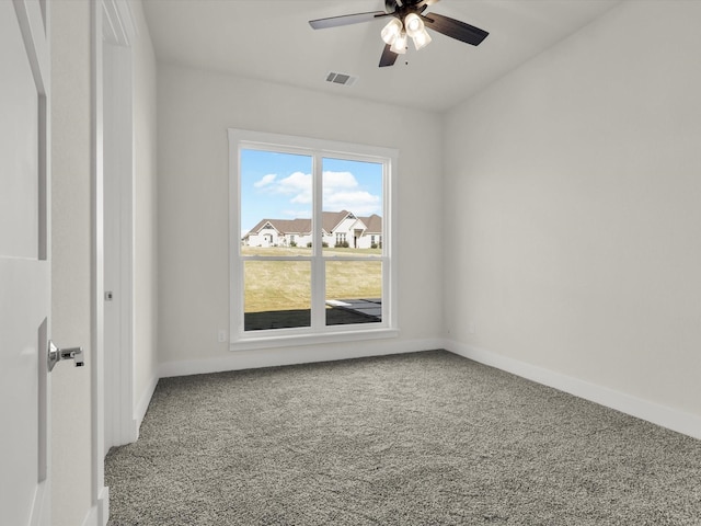 carpeted spare room with ceiling fan