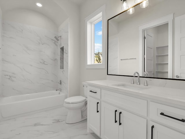 full bathroom with vanity, toilet, and tiled shower / bath