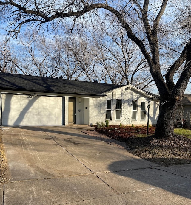 ranch-style house featuring a garage