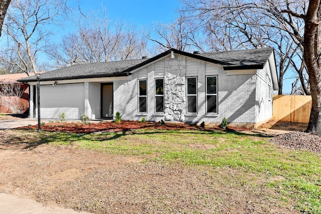 ranch-style house featuring a garage