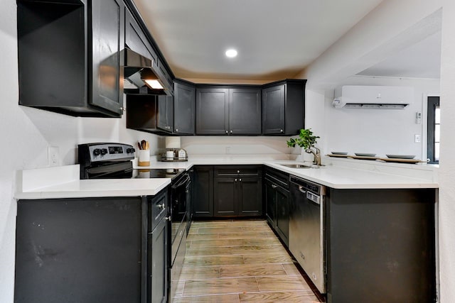 kitchen featuring dishwasher, a wall mounted air conditioner, stainless steel electric range, wall chimney range hood, and sink