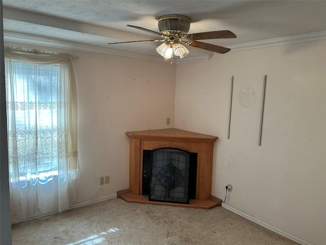 unfurnished living room with ornamental molding, light colored carpet, a textured ceiling, and ceiling fan