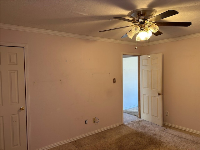 unfurnished room featuring crown molding, ceiling fan, light carpet, and a textured ceiling