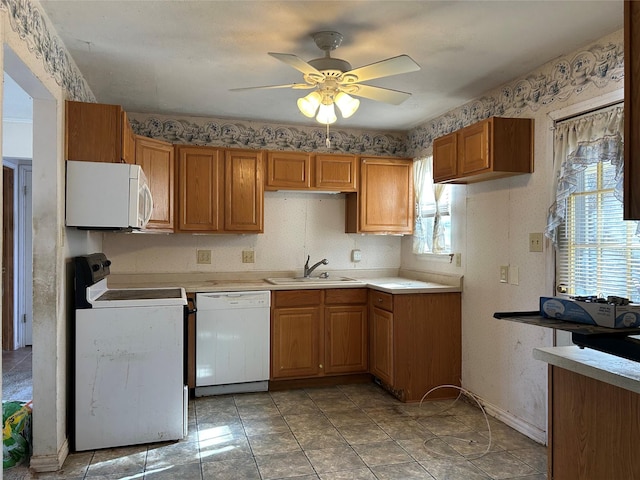 kitchen featuring ceiling fan, sink, light tile patterned floors, and white appliances