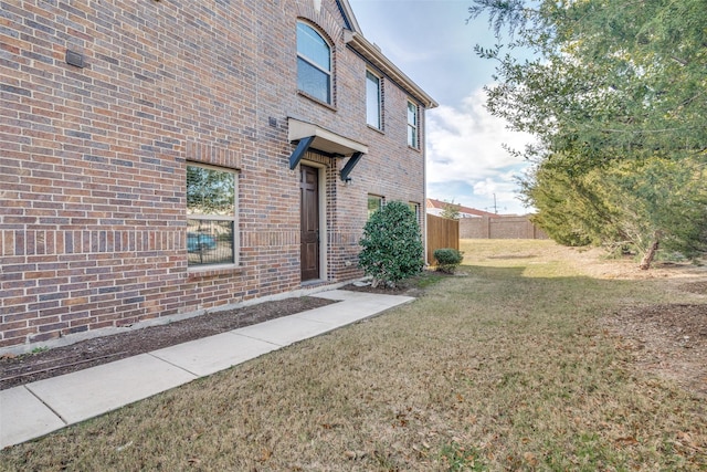 view of property exterior featuring a yard