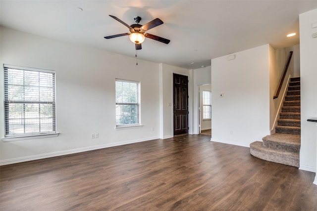 unfurnished room with ceiling fan, dark hardwood / wood-style flooring, and plenty of natural light