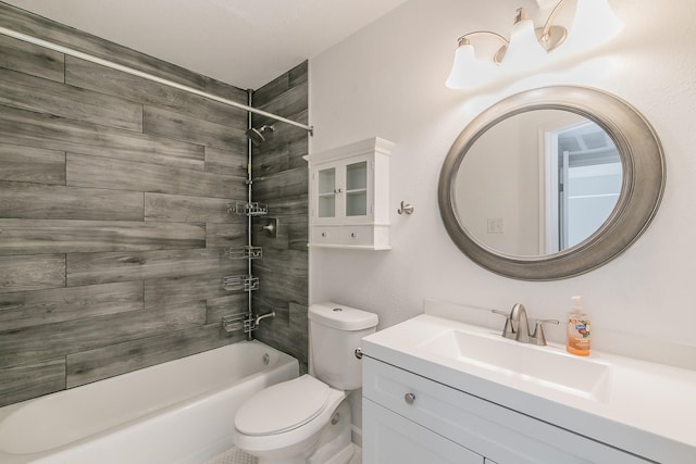 full bathroom with vanity, toilet, and tiled shower / bath