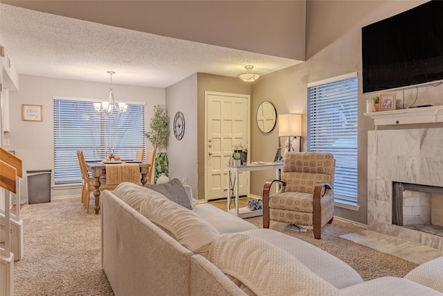 living room with a textured ceiling, a fireplace, and light carpet