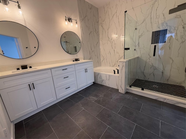 bathroom with vanity, tile patterned flooring, and plus walk in shower