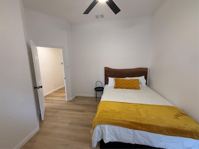 bedroom with hardwood / wood-style flooring and ceiling fan