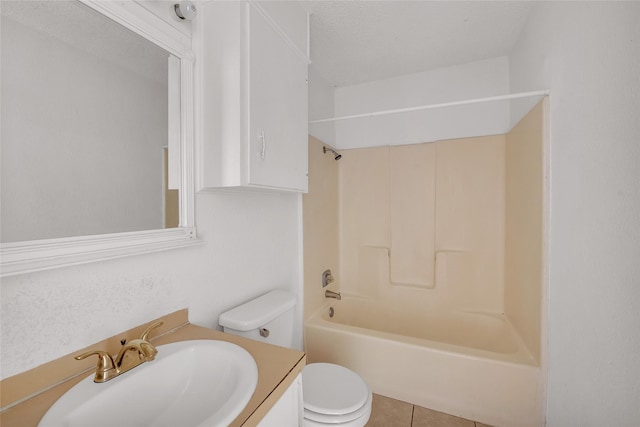 full bathroom with tile patterned floors, bathtub / shower combination, vanity, a textured ceiling, and toilet