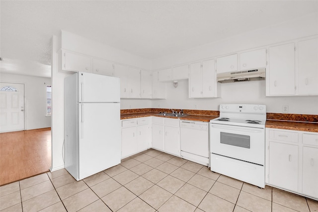 kitchen with white cabinets, white appliances, and sink