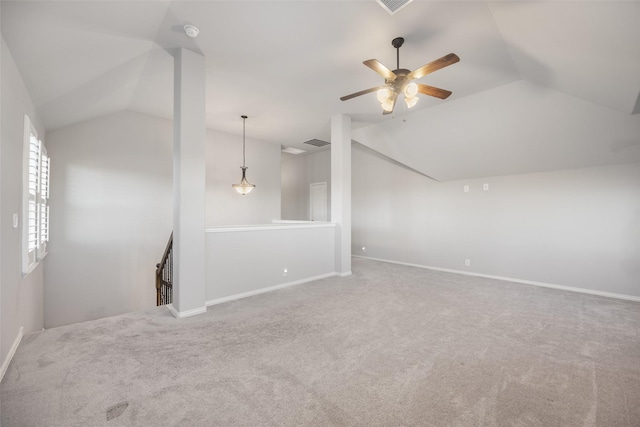 interior space with carpet flooring, ceiling fan, and vaulted ceiling