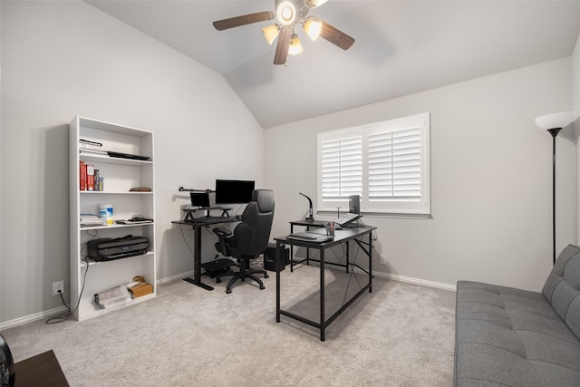 carpeted home office featuring ceiling fan and vaulted ceiling