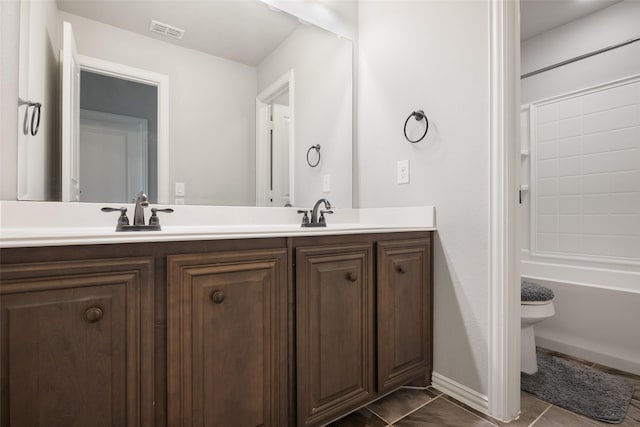 full bathroom featuring tile patterned floors, vanity, toilet, and  shower combination