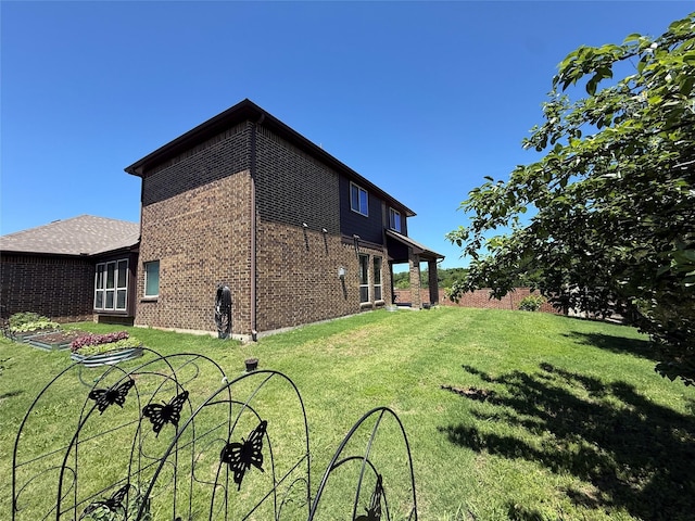 310 Hawthorn Dr, Wylie, TX 75098 - view of property exterior with brick siding and a lawn