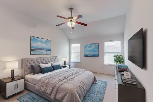 carpeted bedroom featuring ceiling fan and lofted ceiling