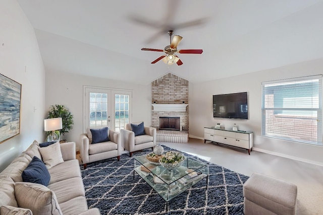 living room with carpet, lofted ceiling, french doors, ceiling fan, and a fireplace