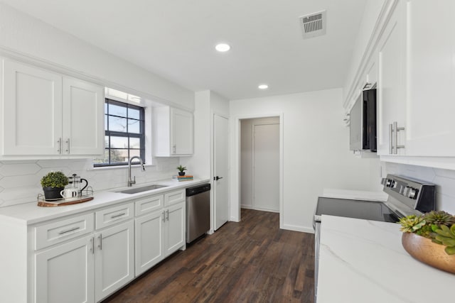 kitchen featuring white cabinetry, appliances with stainless steel finishes, and sink